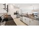 Modern kitchen with granite countertops and stainless steel appliances at 5493 Blue Azure Dr, Wimauma, FL 33598