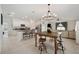 Open kitchen with island, granite counters, and stainless steel appliances at 5493 Blue Azure Dr, Wimauma, FL 33598