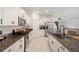 Modern kitchen with granite countertops and stainless steel appliances at 5493 Blue Azure Dr, Wimauma, FL 33598