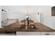 Kitchen island with granite countertop and sink at 5493 Blue Azure Dr, Wimauma, FL 33598