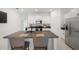 Modern kitchen with stainless steel appliances and granite countertops at 5493 Blue Azure Dr, Wimauma, FL 33598
