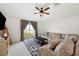 Spacious living room featuring a comfy sectional sofa and backyard access at 5493 Blue Azure Dr, Wimauma, FL 33598