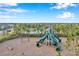 Aerial view of playground with large green slides at 5493 Blue Azure Dr, Wimauma, FL 33598