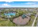 Community playground with slides and play area near pool at 5493 Blue Azure Dr, Wimauma, FL 33598