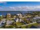 Aerial view of a charming coastal community with stunning waterfront views and lush landscaping perfect for relaxing at 5946 Bayou Grande Ne Blvd, St Petersburg, FL 33703