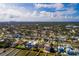 Aerial perspective of a neighborhood near the water, highlighting a single-Gathering home at 5946 Bayou Grande Ne Blvd, St Petersburg, FL 33703