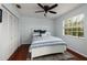 Cozy bedroom with hardwood floors, a ceiling fan, and ample natural light at 5946 Bayou Grande Ne Blvd, St Petersburg, FL 33703