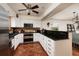 Bright kitchen featuring white cabinetry, stainless steel appliances, and a breakfast bar at 5946 Bayou Grande Ne Blvd, St Petersburg, FL 33703
