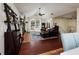 Bright living room with high ceilings, large window, hardwood floors, and neutral decor at 5946 Bayou Grande Ne Blvd, St Petersburg, FL 33703
