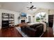 Cozy living room features a fireplace, large arched window, and comfortable seating area at 5946 Bayou Grande Ne Blvd, St Petersburg, FL 33703