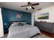 Serene main bedroom with a modern color scheme, ceiling fan, and ensuite bathroom access at 5946 Bayou Grande Ne Blvd, St Petersburg, FL 33703