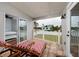Relaxing covered patio with lounge chairs offering a view of the backyard at 5946 Bayou Grande Ne Blvd, St Petersburg, FL 33703