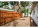 Backyard with wooden fence and side gate at 601 Paris S Ave, St Petersburg, FL 33701