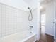 Bathroom with shower/tub combo and white tile at 601 Paris S Ave, St Petersburg, FL 33701