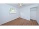 Well-lit bedroom with wood floors and a closet at 601 Paris S Ave, St Petersburg, FL 33701