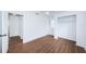 Bedroom with wood floors and access to bathroom and hallway at 601 Paris S Ave, St Petersburg, FL 33701