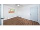 Bright bedroom with wood-look floors and a ceiling fan at 601 Paris S Ave, St Petersburg, FL 33701