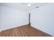 Bright bedroom with wood floors and a door at 601 Paris S Ave, St Petersburg, FL 33701
