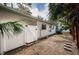 Backyard view of house with white fence and gate at 601 Paris S Ave, St Petersburg, FL 33701
