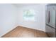Simple kitchen with stainless steel refrigerator and wood-look floors at 601 Paris S Ave, St Petersburg, FL 33701