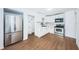 Modern kitchen with white cabinets, stainless steel appliances, and marble countertops at 601 Paris S Ave, St Petersburg, FL 33701