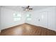 Bright living room with hardwood floors and a ceiling fan at 601 Paris S Ave, St Petersburg, FL 33701
