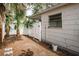 Side yard with white fence and small gate at 601 Paris S Ave, St Petersburg, FL 33701