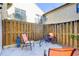 Private backyard with wooden fence, chairs, and bike at 6262 142Nd N Ave # 505, Clearwater, FL 33760