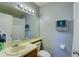 Neat bathroom with a single sink vanity, shower, and toilet at 6262 142Nd N Ave # 505, Clearwater, FL 33760