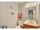 Clean bathroom with a single sink vanity and toilet at 6262 142Nd N Ave # 505, Clearwater, FL 33760
