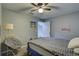 Serene bedroom with a double bed, chair, and ceiling fan at 6262 142Nd N Ave # 505, Clearwater, FL 33760