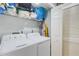 Functional laundry room with washer, dryer, and shelving at 6262 142Nd N Ave # 505, Clearwater, FL 33760