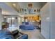 Open living room with a sleeper sofa and access to the kitchen and patio at 6262 142Nd N Ave # 505, Clearwater, FL 33760
