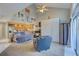 Open living room with vaulted ceilings, a sleeper sofa, and access to the patio at 6262 142Nd N Ave # 505, Clearwater, FL 33760