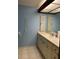 Bathroom with single vanity and blue walls at 702 Dorado Ct, Brandon, FL 33511