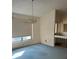 Simple dining room with light-blue carpet and chandelier at 702 Dorado Ct, Brandon, FL 33511