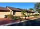 Tan house with brown roof, attached garage, and landscaping at 702 Dorado Ct, Brandon, FL 33511