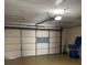 Attached garage with overhead door and ample space for parking and storage at 702 Dorado Ct, Brandon, FL 33511