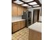 Kitchen with wood cabinets, stainless steel appliances, and skylights at 702 Dorado Ct, Brandon, FL 33511