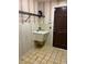 Laundry room features a utility sink and shelving for storage at 702 Dorado Ct, Brandon, FL 33511
