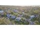 Aerial view of the house and neighborhood, near the water at 1890 San Mateo Dr, Dunedin, FL 34698