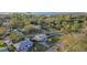 Aerial view of the house, neighborhood and waterfront at 1890 San Mateo Dr, Dunedin, FL 34698
