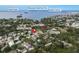 Aerial view showcasing the house's location near a park and water at 1890 San Mateo Dr, Dunedin, FL 34698