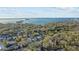 Wide aerial view of the house and neighborhood, near the water at 1890 San Mateo Dr, Dunedin, FL 34698
