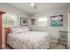 Comfortable bedroom with a queen-size bed and plenty of natural light at 1890 San Mateo Dr, Dunedin, FL 34698