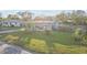 Single-story home with a carport and a well-maintained lawn at 1890 San Mateo Dr, Dunedin, FL 34698