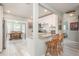 Modern kitchen with white shaker cabinets, granite counters, and stainless steel appliances at 1890 San Mateo Dr, Dunedin, FL 34698