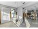 Damage kitchen with exposed framing, flooring, and plumbing at 1890 San Mateo Dr, Dunedin, FL 34698