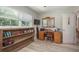 Home office features built-in shelving and a spacious desk at 1890 San Mateo Dr, Dunedin, FL 34698