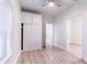 Bedroom featuring wood look flooring, built in wardrobe, and window with bright, natural light at 3424 Queensboro S Ave, St Petersburg, FL 33711